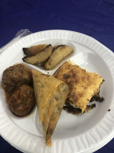 Photo courtesy of Elizabeth Koeppen: One of my plates this year consisted of lemon potatoes, keftedes, spanakopita, and moussaka. The keftedes are almost like meatballs, but the sauce is something I can’t get enough of. 