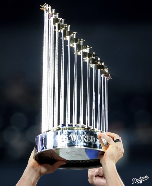 With stadium lights glimmering, the Dodgers raise the World Series Trophy high and proud for all the fans to see. This isn’t the first time the boys have held this trophy – they’ve lifted it in their past glory seasons before.

