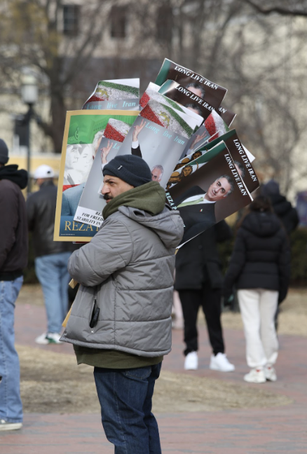 A man participates in a pro-Shah demonstration. Reza Pahlavi currently resides in the United States, and serves as an active voice for Iranian democracy.