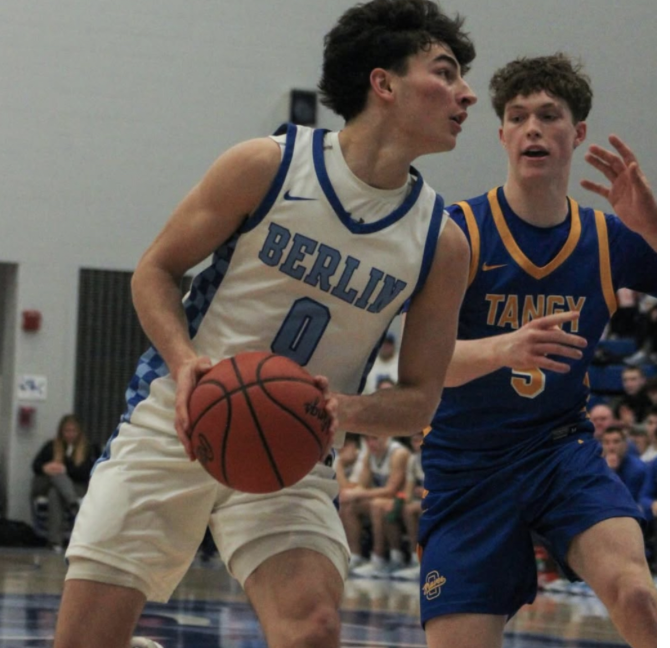 Olentangy guard Ty Walburn defends a shot from Olentangy Berlin guard Luca Filia during an OCC-Cardinal matchup between the Olentangy Braves and Olentangy Berlin Bears in Delaware, Ohio, on Friday, Feb. 20.