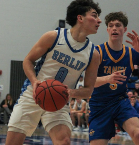 Olentangy guard Ty Walburn defends a shot from Olentangy Berlin guard Luca Filia during an OCC-Cardinal matchup between the Olentangy Braves and Olentangy Berlin Bears in Delaware, Ohio, on Friday, Feb. 20. The Braves went on to defeat the Bears. 