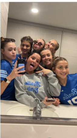 The players settle down, take one last look in the mirror and put their cleats on. Moments before, they huddled to talk about their goal to start strong in the season. 