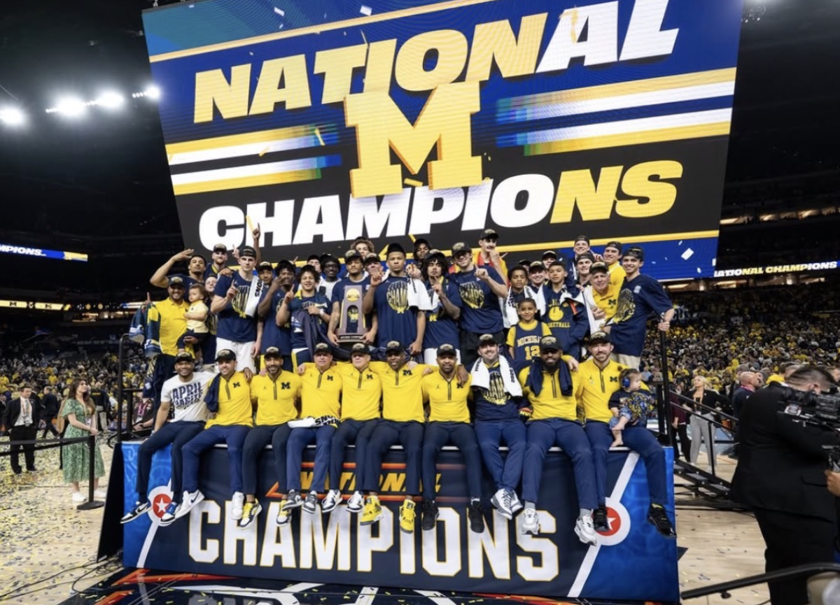 The Michigan men’s basketball team celebrates their championship victory. With their victory, the Wolverines finished the season 37-3.

