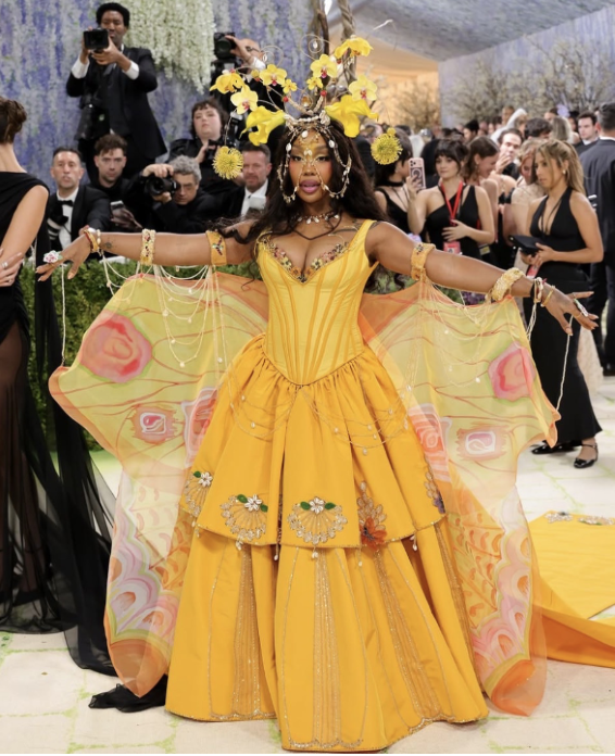 R&B singer SZA arrives in a yellow gown with colorful butterfly wings to the Met Gala. Designer Emily Adams Bode Aujla explained in a Vogue interview that all the components of the dress are entirely from eBay.