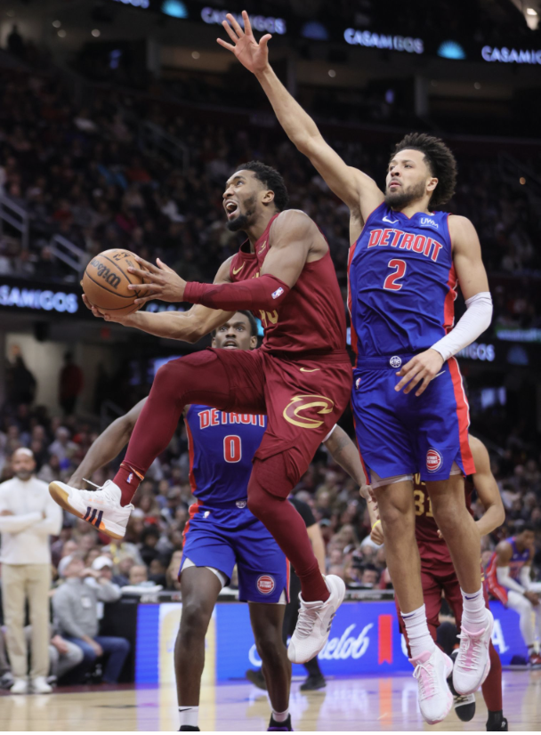 Cleveland’s Donovan Mitchell looks to lay the ball up, while being guarded by Detroit’s Cade Cunningham. This game ended in a Cleveland win, 128-121.